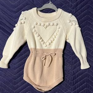 Girl’s romper sweater with heart design